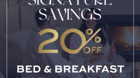 Two people in robes sit by a fireplace with text overlay: 