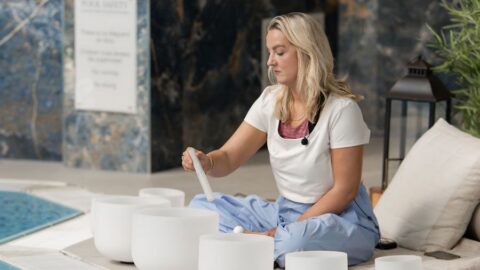 Relaxing sound therapy by the indoor pool, featuring serene crystal bowls for ultimate guest wellness experience.